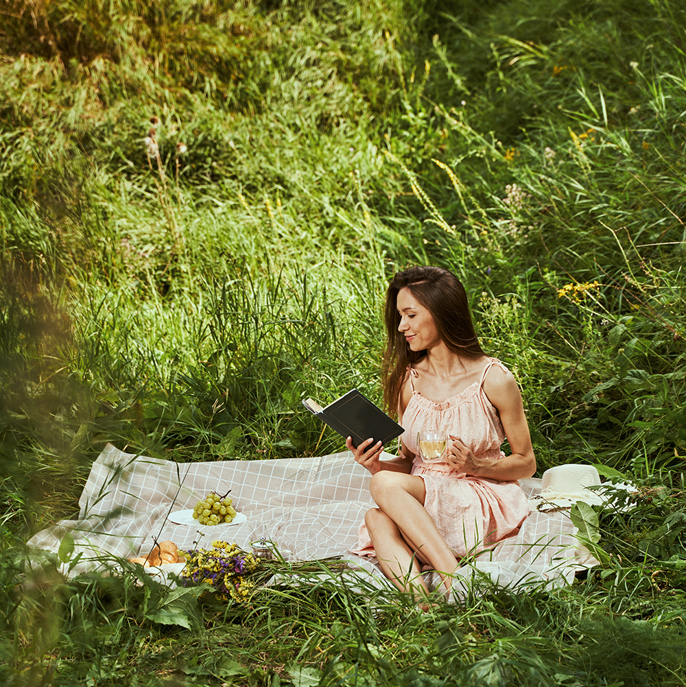 beautiful-lady-enjoying-her-favorite-book-outdoors-2025-03-05-04-43-09-utc 1000p rect